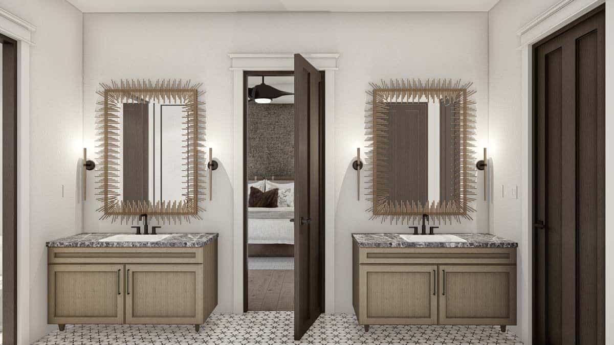 His and her vanities with granite countertops and decorative mirrors.