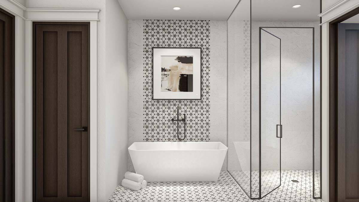 Primary bathroom with a soaking tub and a glass-enclosed shower.