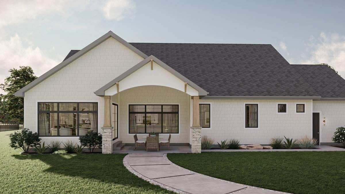 Rear view of the house showcasing the covered patio supported by stone base columns.