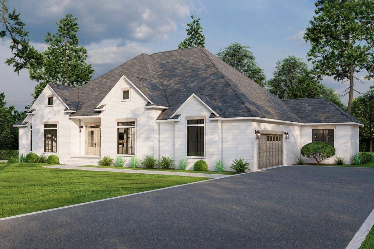 Front-right view with a covered entry and a side-loading garage with an asphalt driveway.