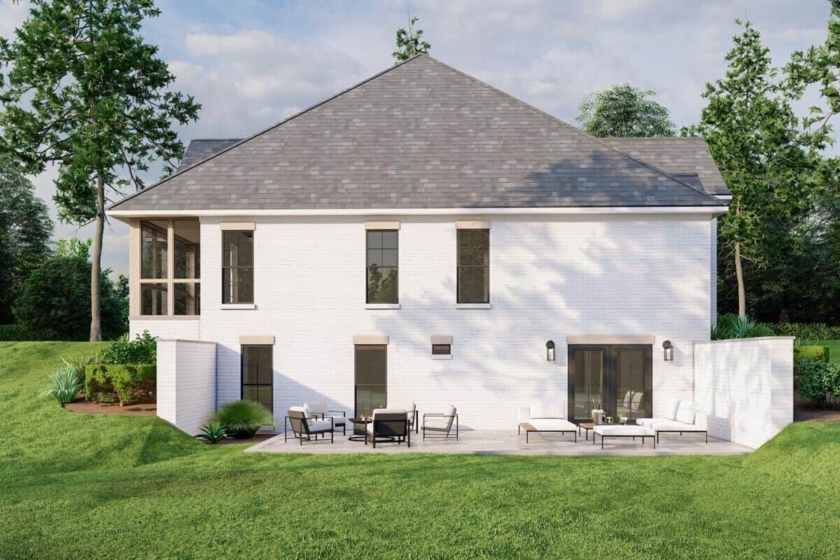 Left view of the house showcasing its walkout basement with a spacious patio.