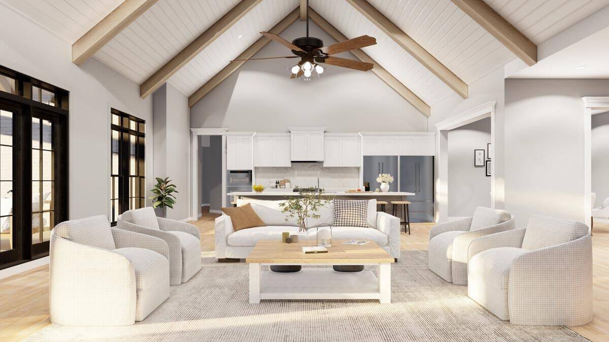 The great room opens to the kitchen and is crowned with a cathedral ceiling.