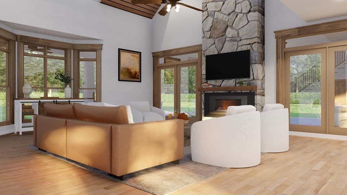 The great room includes a vaulted ceiling and a bay window.