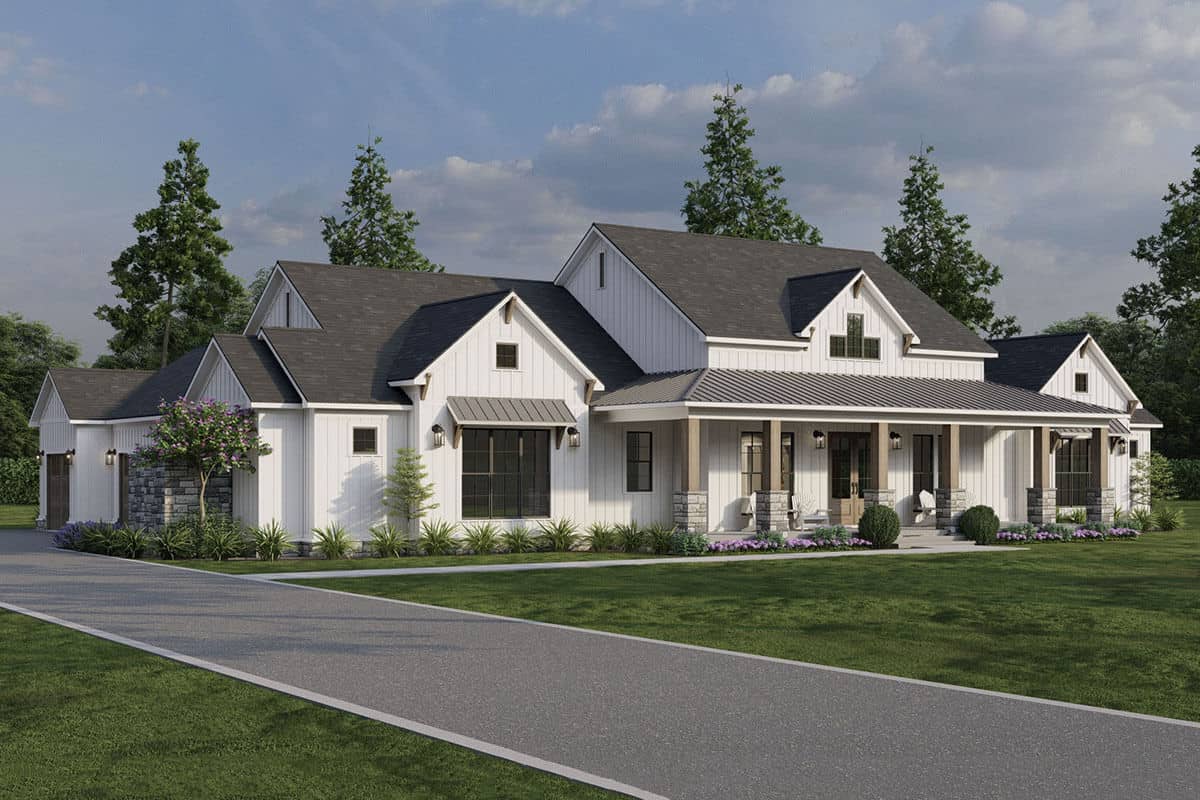 Front-left view with a side-loading garage and a covered entry porch framed with stone base columns.