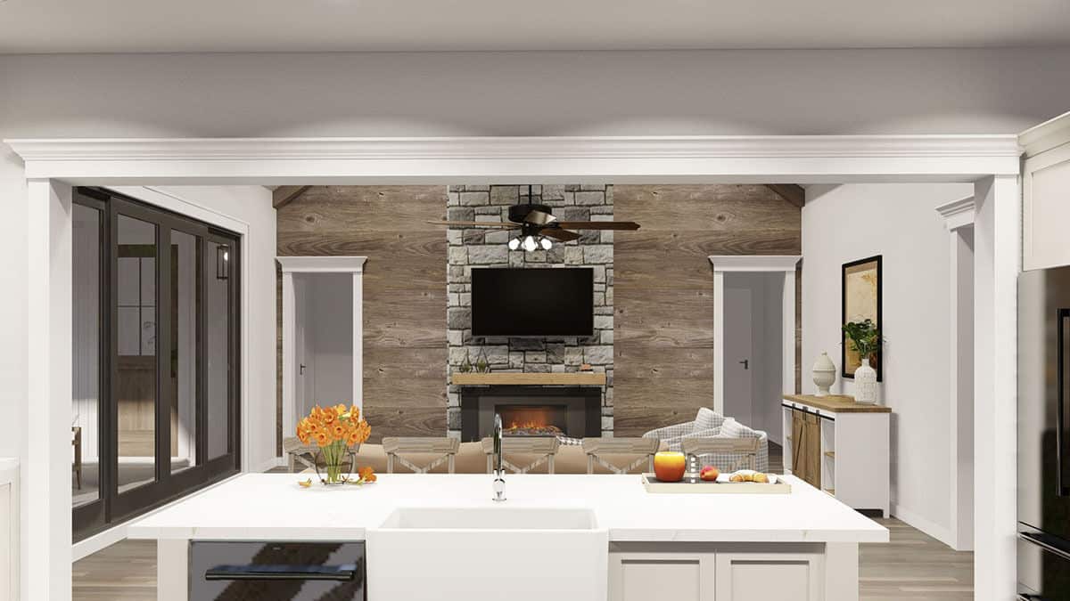 Kitchen island with a farmhouse sink overlooking the great room.