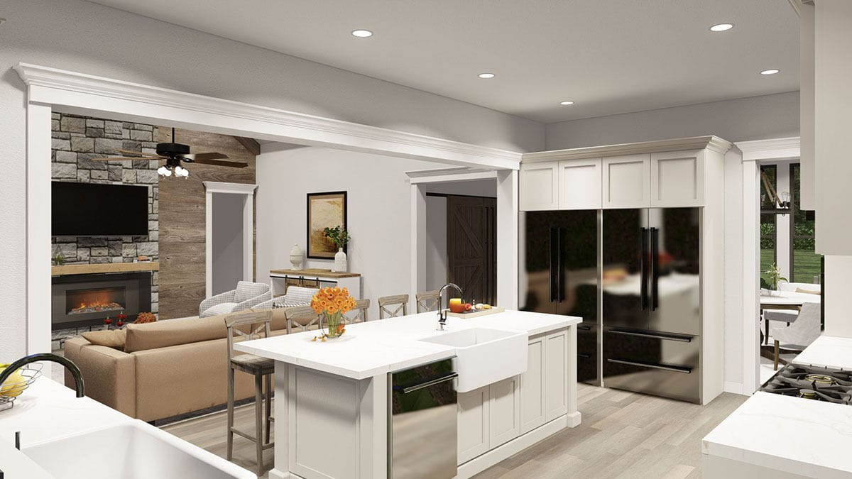 Kitchen and great room connected by a large opening.