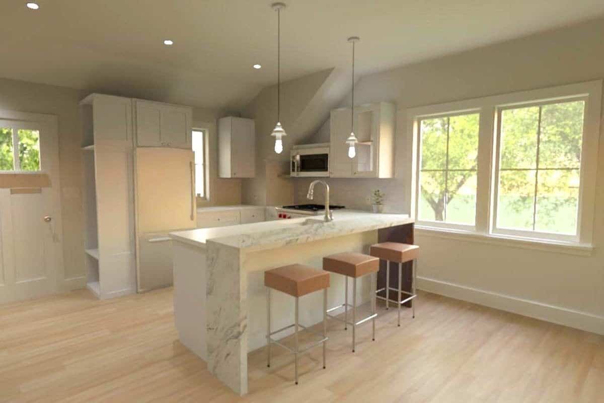 Kitchen with white cabinets, stainless steel appliances, and a peninsula with a marble eating bar.