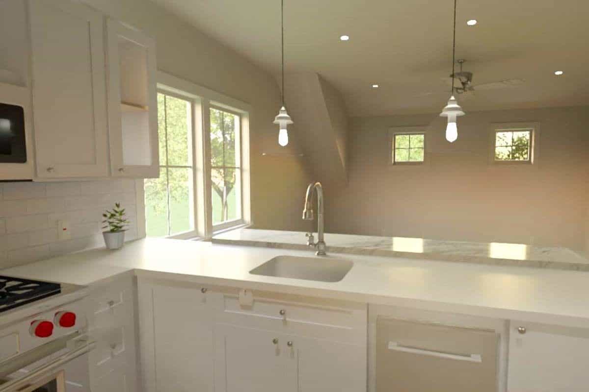The peninsula bar includes a prep sink overlooking the living area.