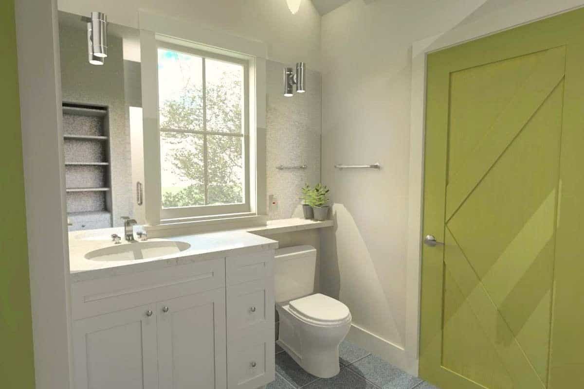 Bathroom with a sink vanity, a toilet, and a green door.
