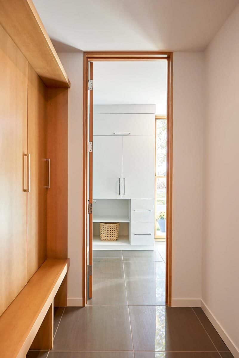 Mudroom with built-in cabinets and a bench,