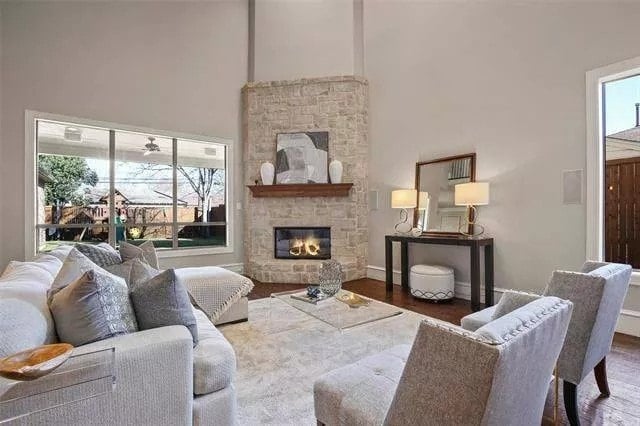 A corner fireplace warms the family room.