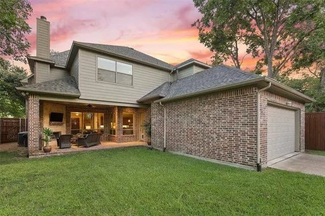 Rear view of the house showcasing the double garage and covered outdoor living.