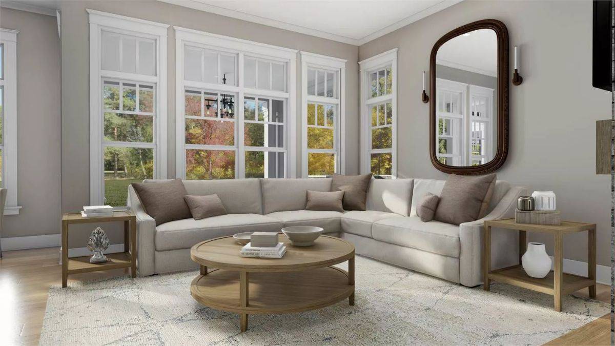 The family room includes a wall mirror and an L-shaped sofa over an area rug.