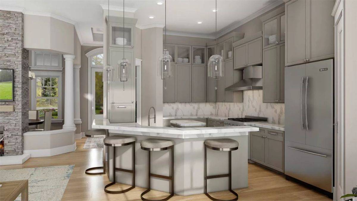 Kitchen with gray cabinets and an angled peninsula paired with round bar stools.