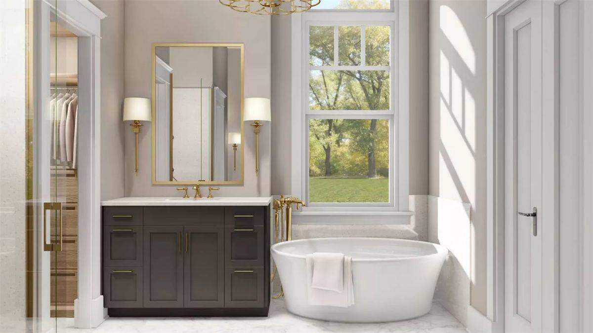A white-framed window above the soaking tub illuminates the primary bathroom.