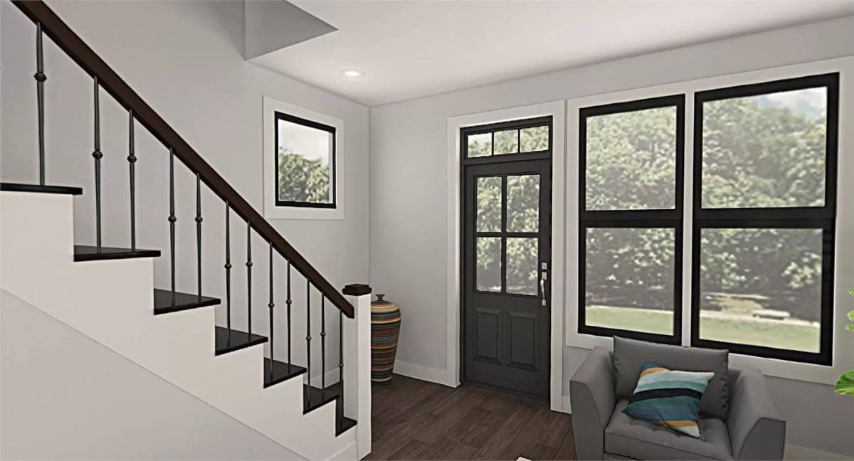 Entry with a glazed front door and a staircase leading to the upstairs bedrooms.