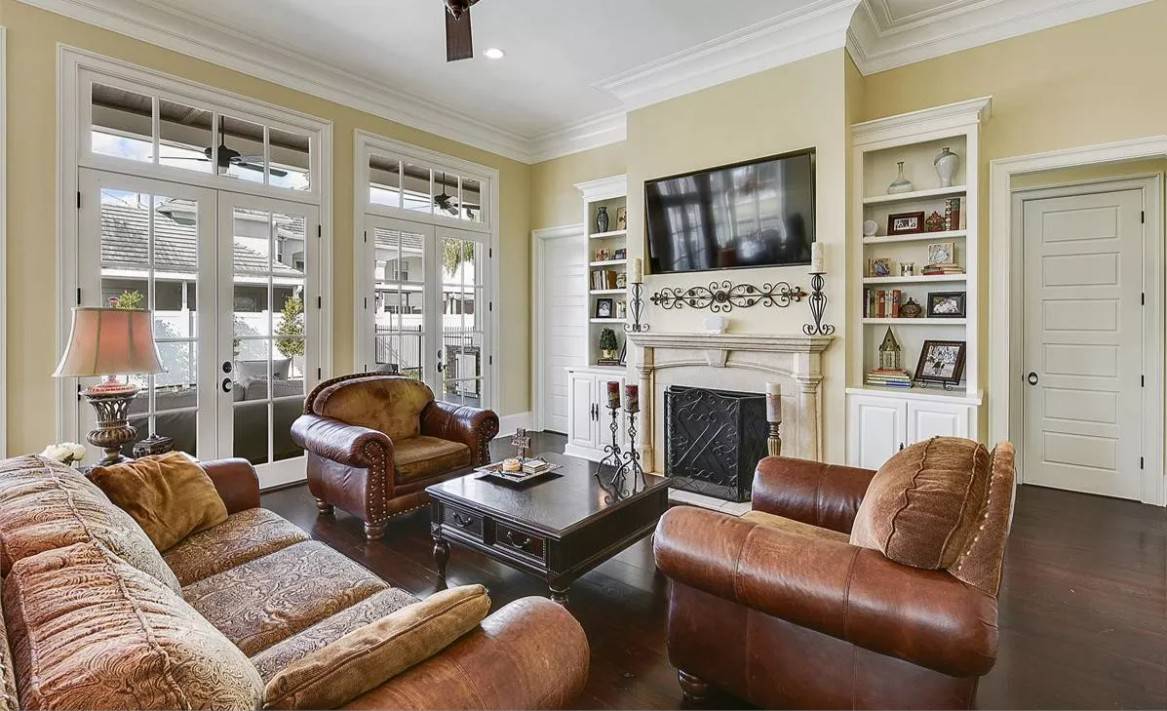 Two sets of French doors extend the family room onto a covered porch.