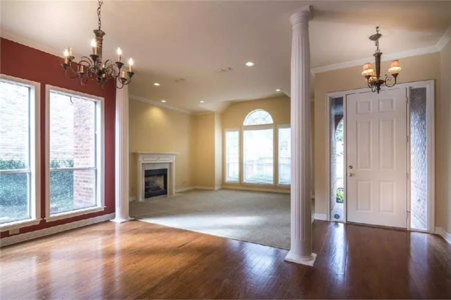 Foyer and living room defined by round columns.