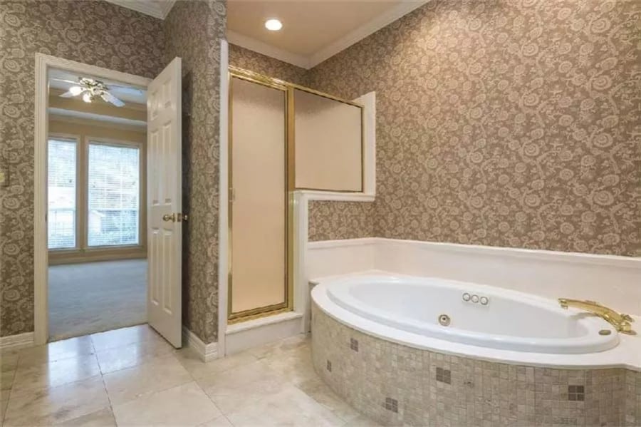 Primary bathroom with a soaking tub and a walk-in shower.