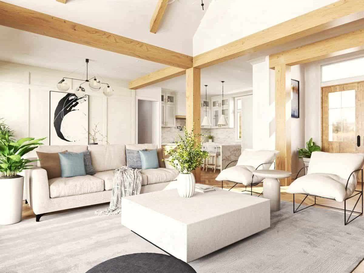 Great room with beige seats, a modern coffee table, and a vaulted ceiling lined with exposed beams.