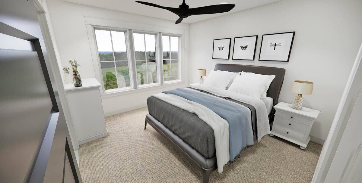 Secondary bedroom with a leather platform bed flanked by white nightstands.
