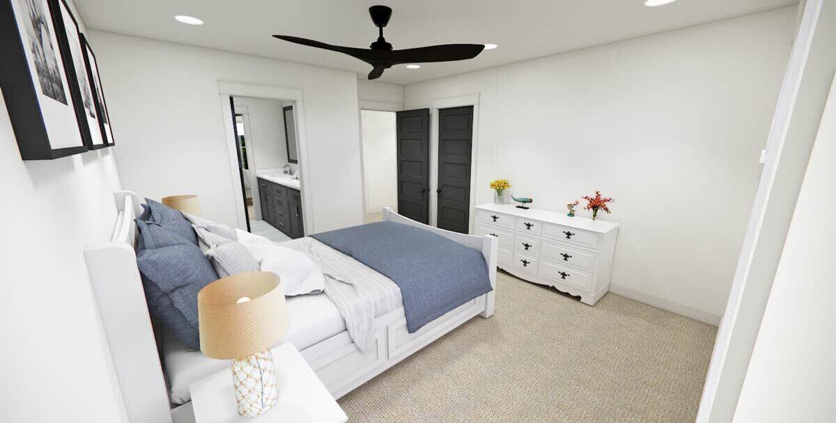 Secondary bedroom with white furnishings and an ensuite bathroom.