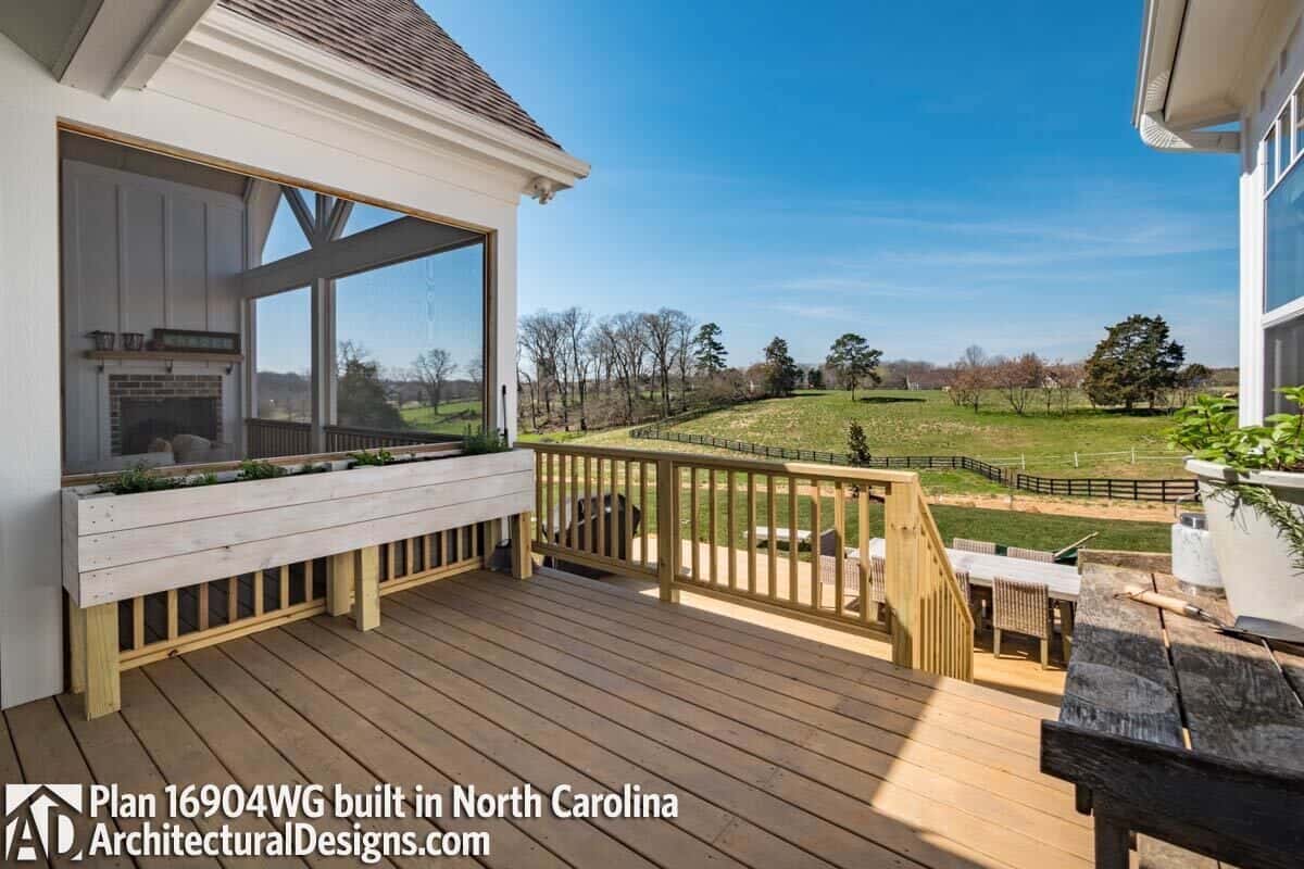 Sun deck with wide plank flooring and expansive backyard views.