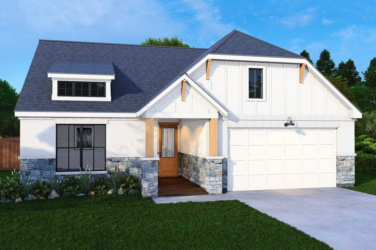 Front view of the house with a double garage, a covered entry, and a shed dormer.