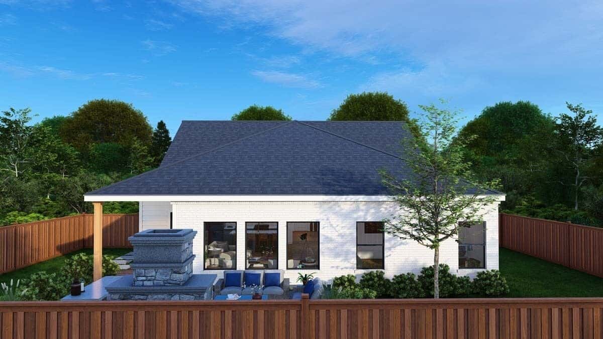 Rear view of the house with a covered porch and an open patio.