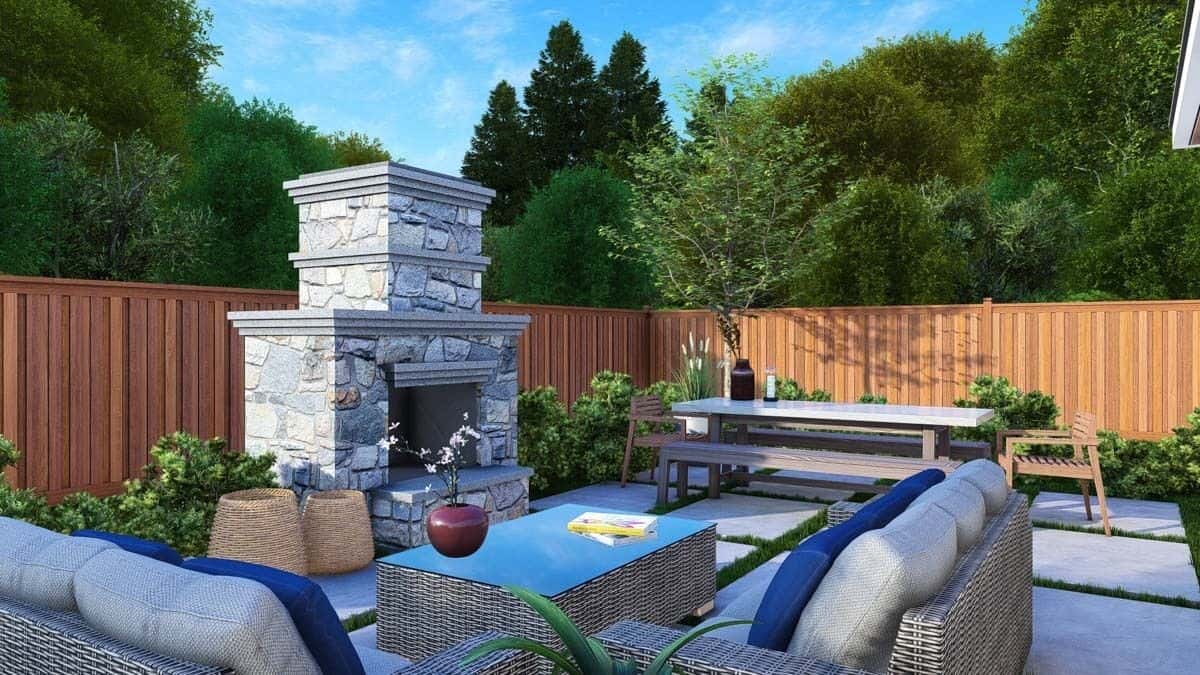 Concrete patio with a stone fireplace, wicker seats, and an outdoor dining.