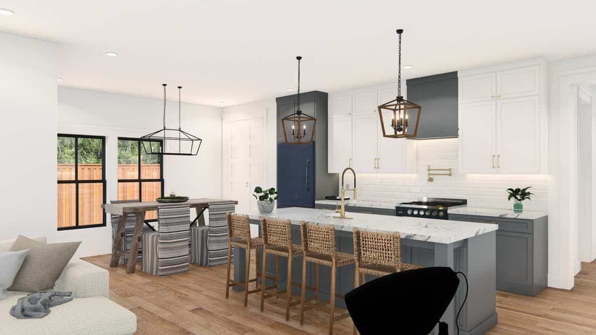 Kitchen and dining area with white walls and hardwood flooring.