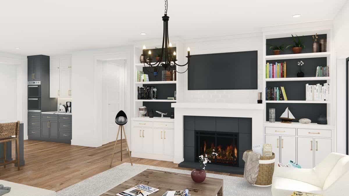 Living room with white built-ins and a fireplace topped with a TV.