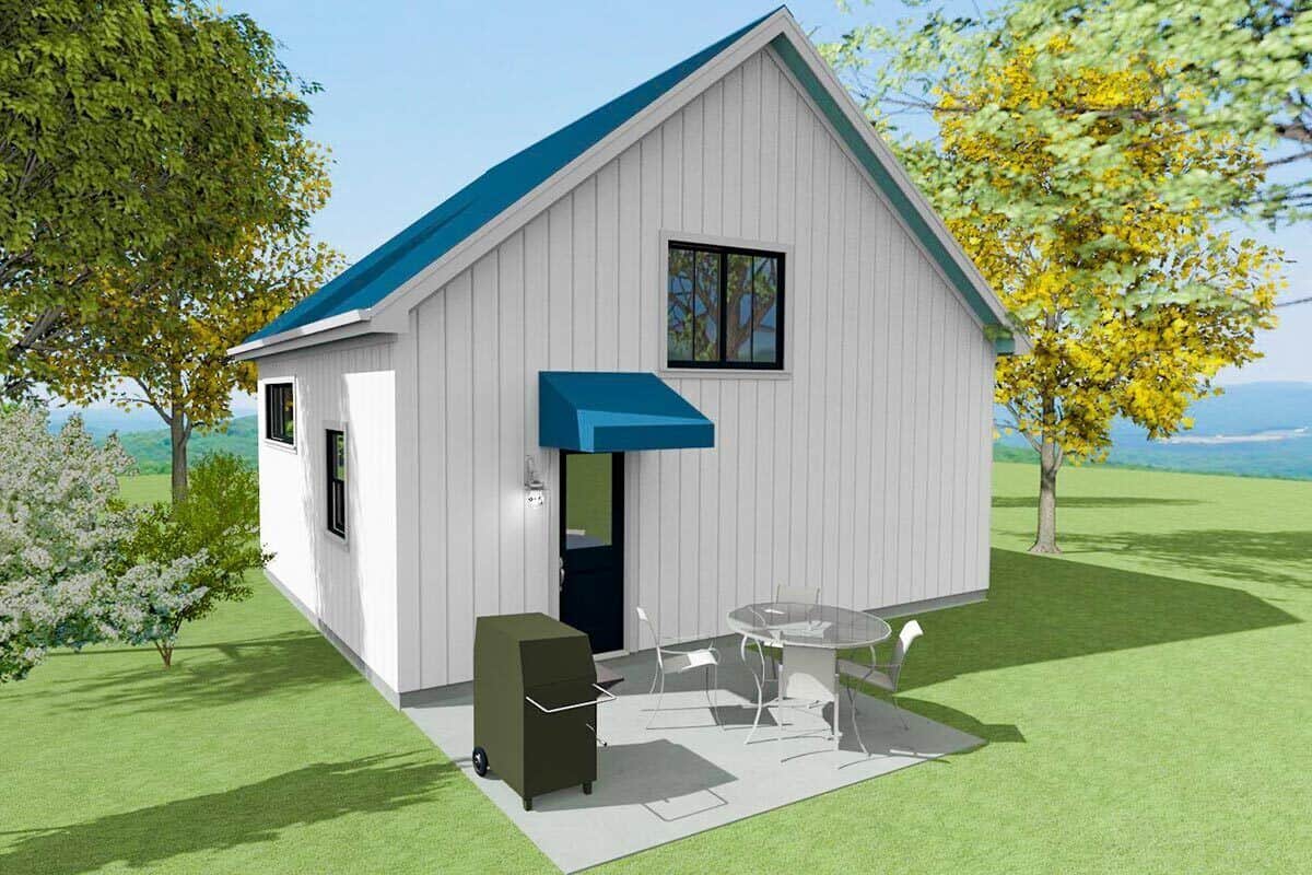 Rear view of the house with a gable roof and an open patio.