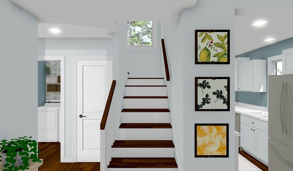 Entry with a staircase leading to the upstairs loft.