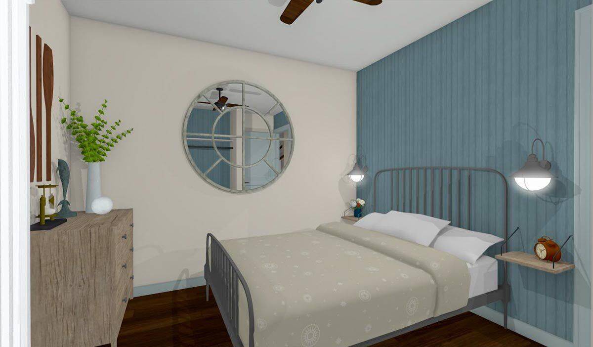 Bedroom with a decorative mirror, a wooden dresser, and a metal bed against the accent wall.