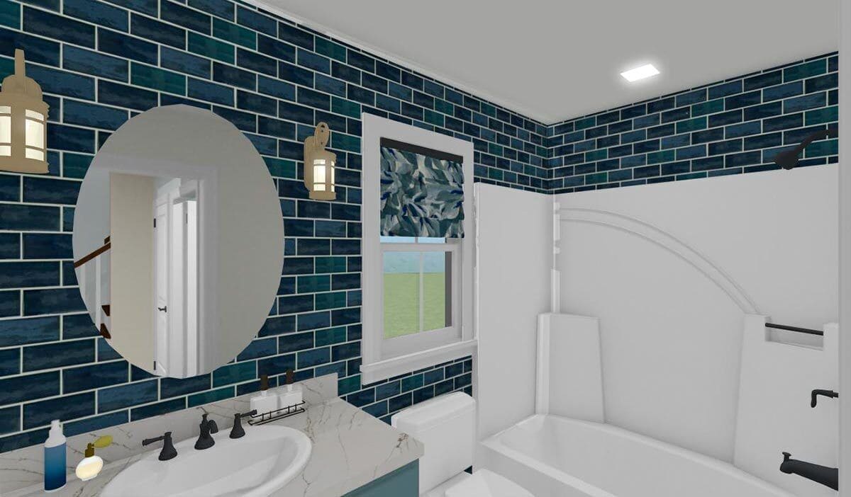 Shared bathroom with a sink vanity and a tub and shower combo surrounded by blue subway tiled backsplash.