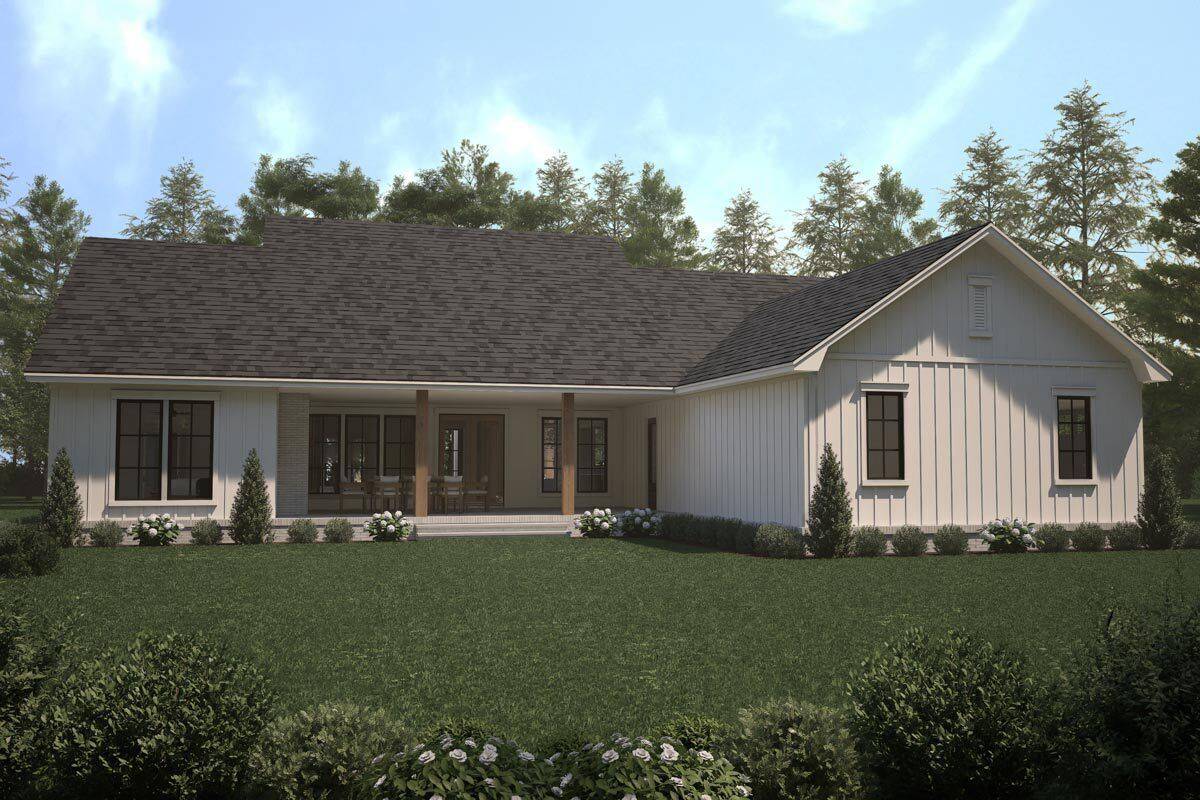 Rear view of the house showcasing the covered patio framed with wooden columns.