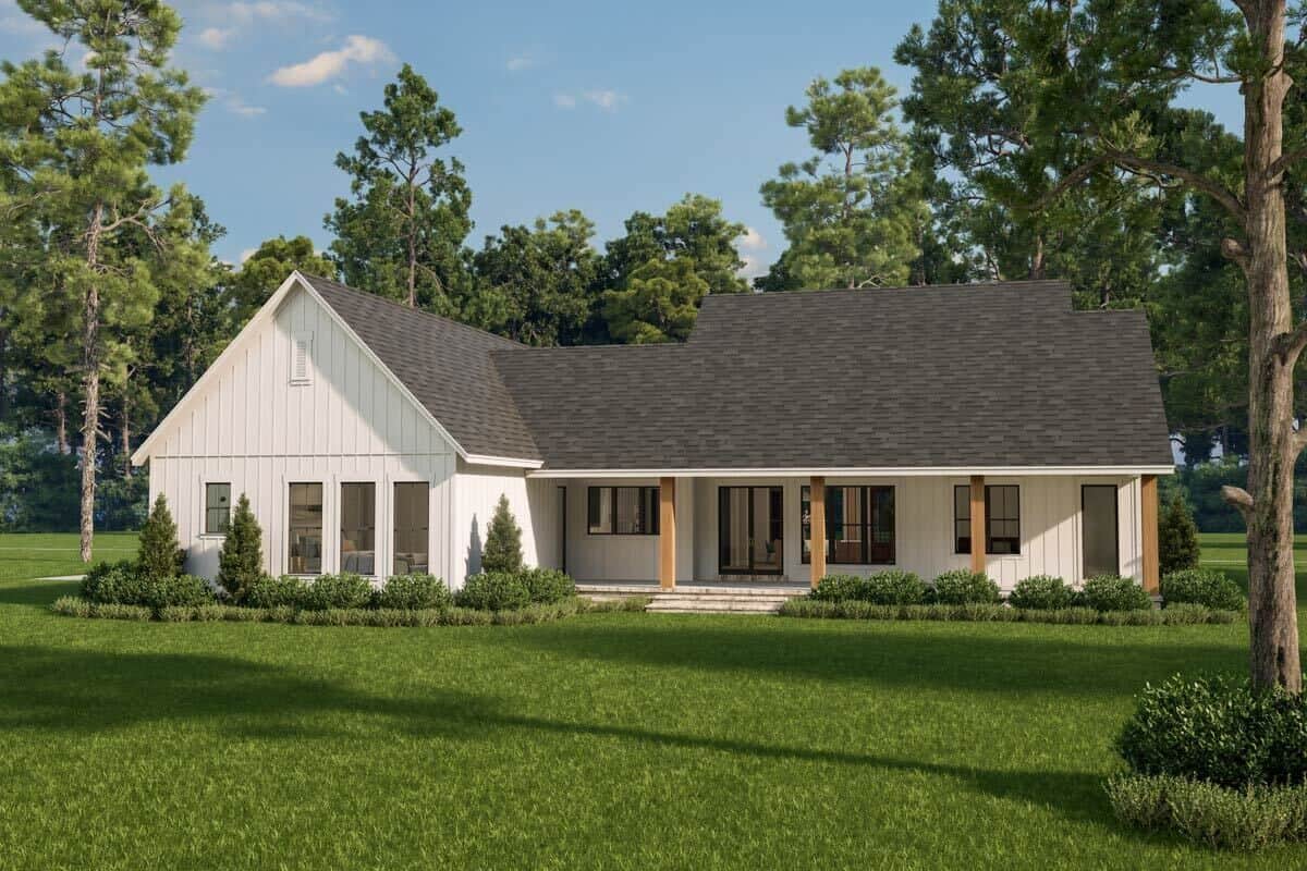 Rear view of the house with plenty of windows and a covered patio.