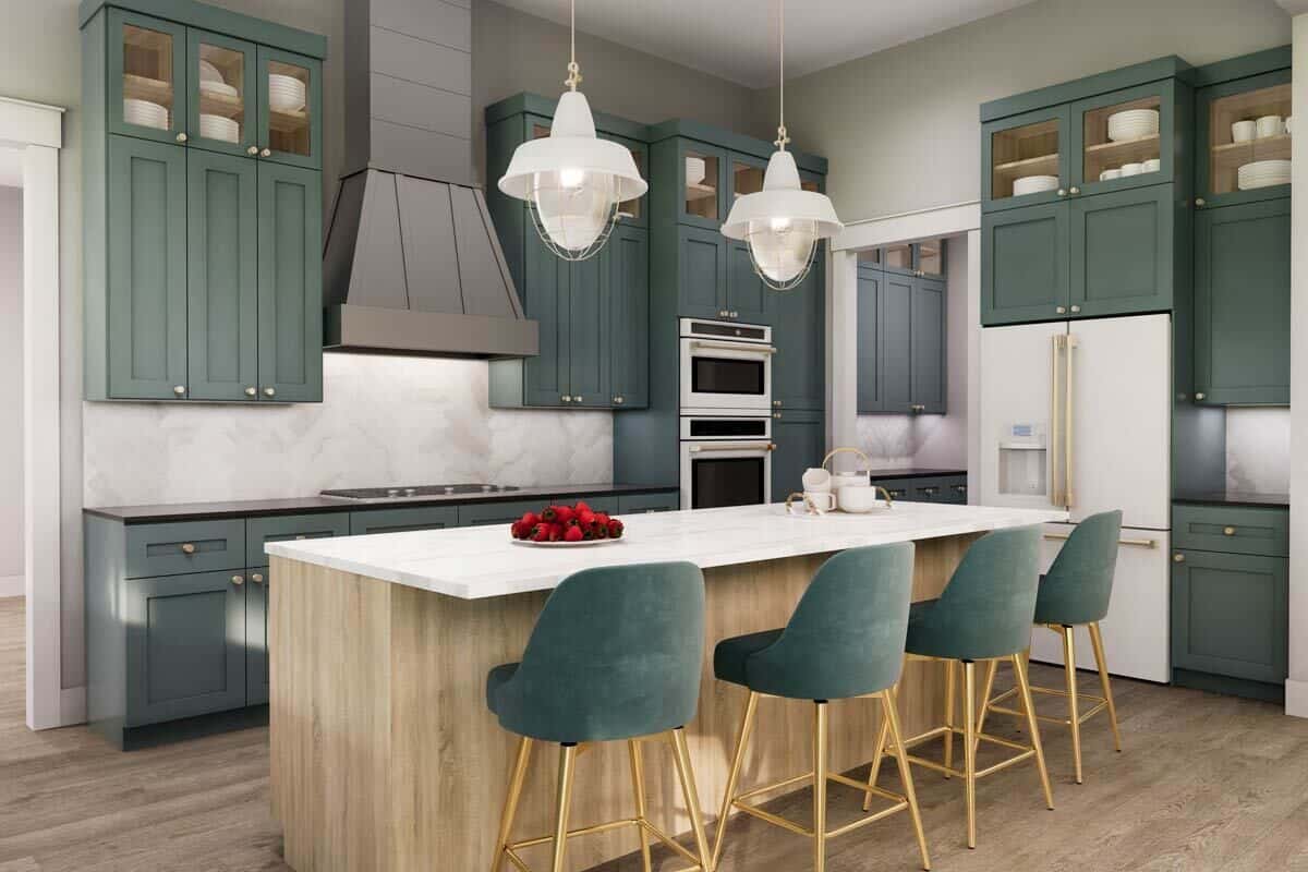 Kitchen with custom cabinetry, modern appliances, and a breakfast island with seating for four.