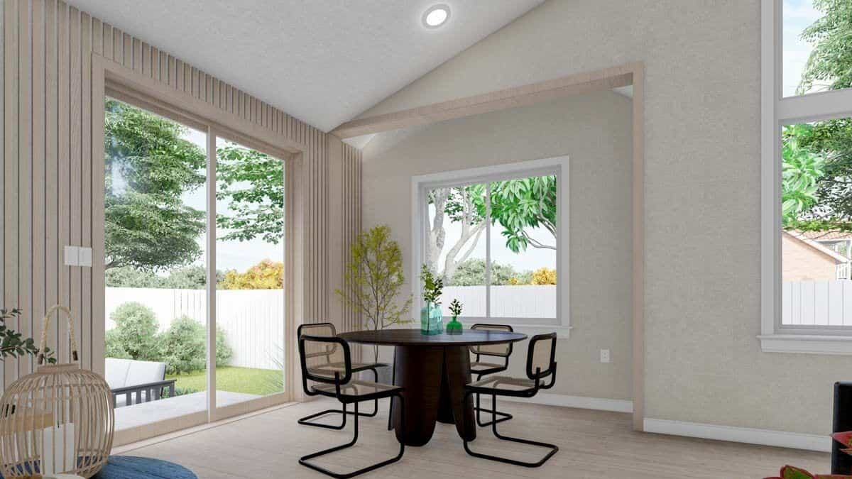 Dining room with a round dining set and sliding glass doors that open onto the rear patio.
