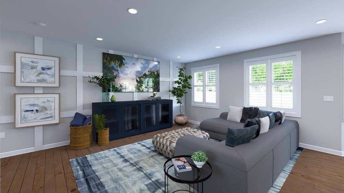 Family room with an L-shaped sectional and a TV mounted above the console table.
