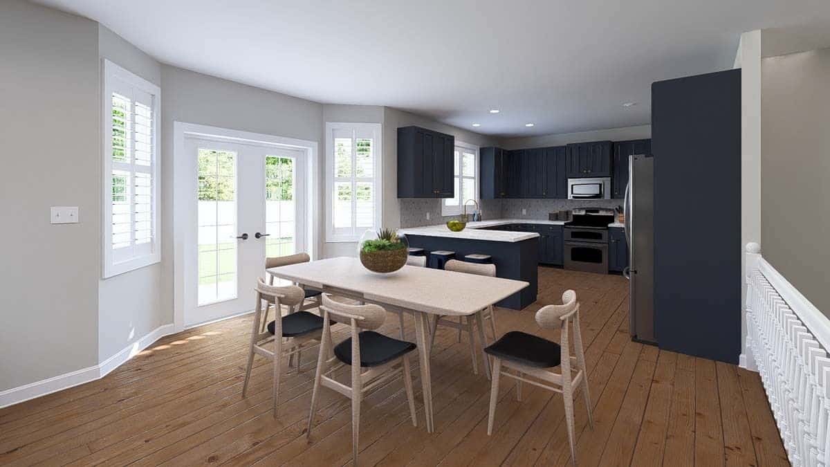 Dining area with a wooden dining set and a French door that opens to the rear patio.