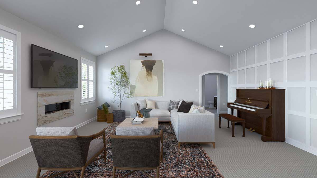 Family room with an L-shaped sofa, cushioned chairs, an upright piano, and a TV mounted above the linear fireplace.