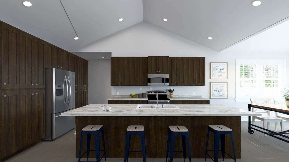 Kitchen with dark wood cabinets, marble countertops, and a breakfast island under the cathedral ceiling.