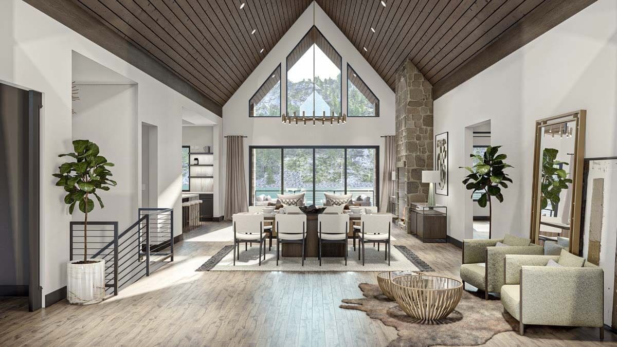 An open layout view of the foyer, dining room, and great room under a cathedral ceiling.