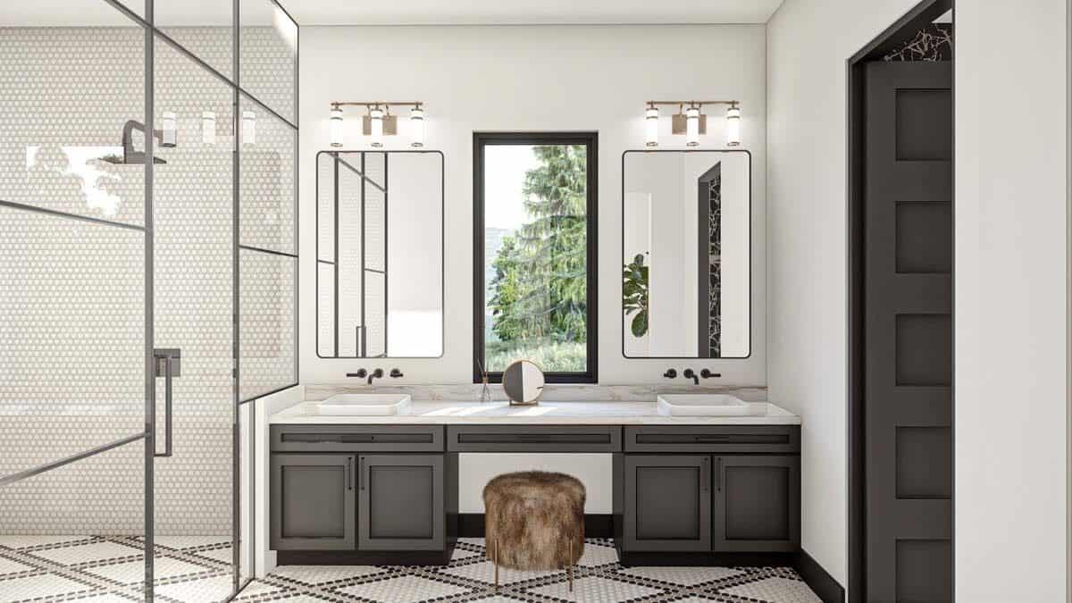 Primary bathroom with a dual sink vanity and a walk-in shower.