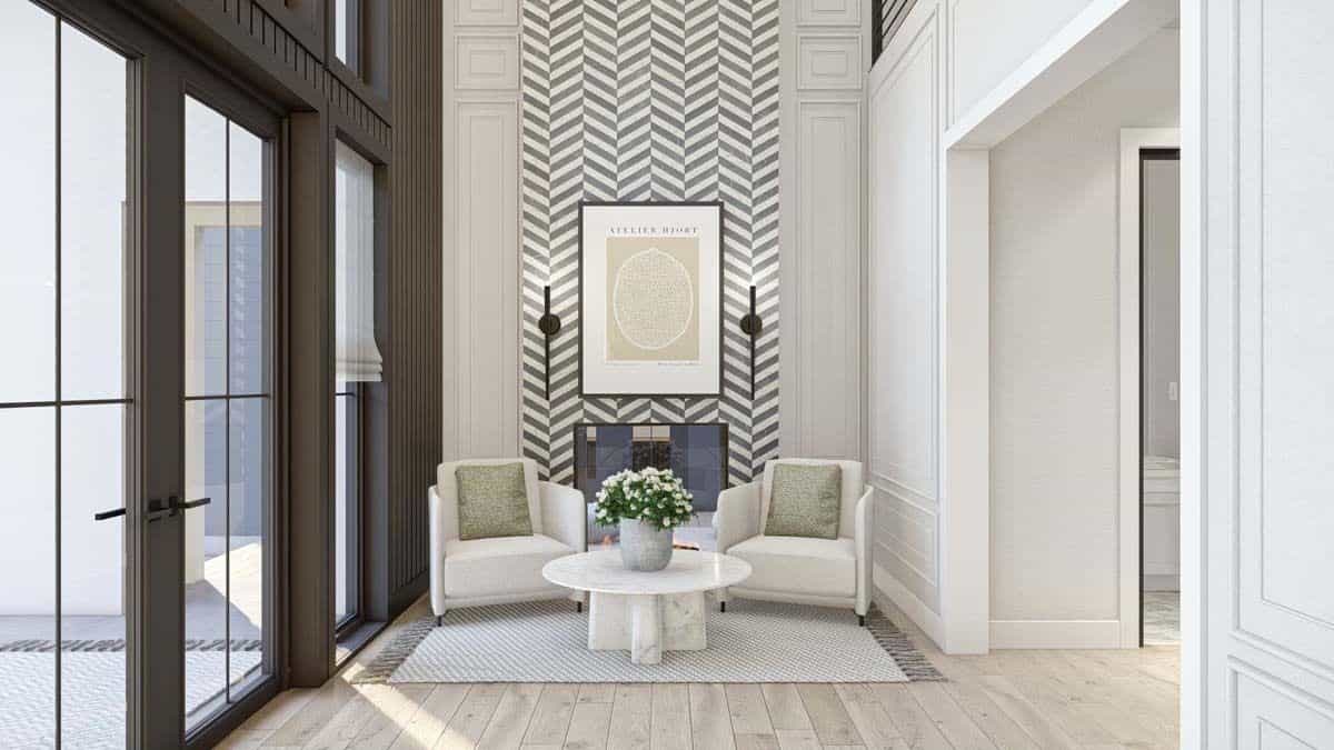 Foyer with wainscoted walls and modern armchairs paired with a marble coffee table.