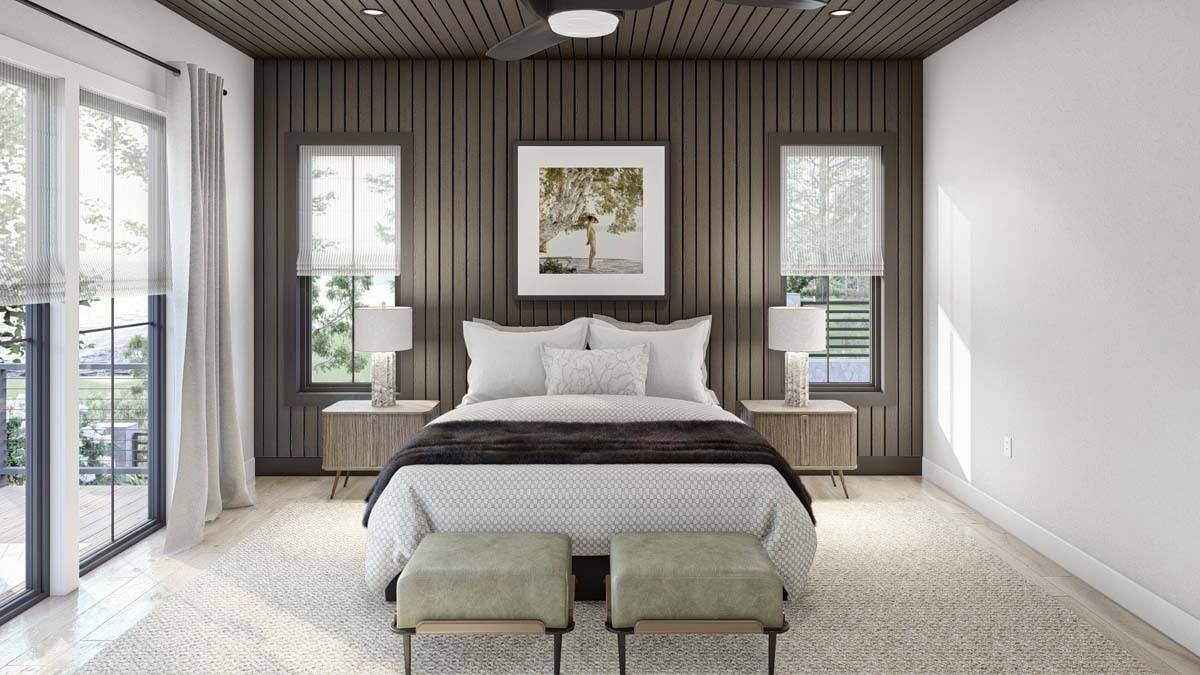 Primary bedroom with tall windows and a wood-paneled ceiling that extends to the accent wall.