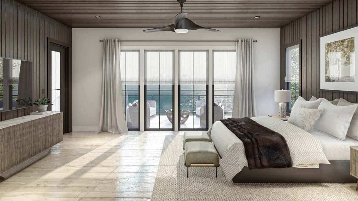 The primary bedroom includes hardwood flooring and outdoor access via a glazed door.