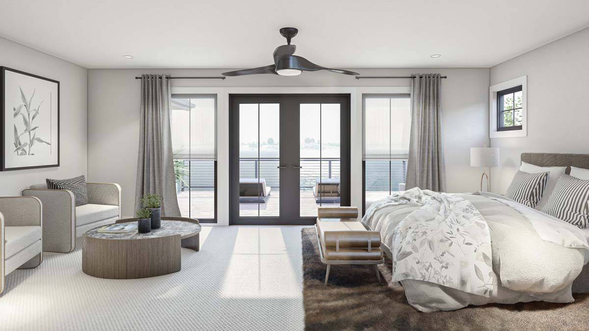 Bedroom with a sitting area and a French door that opens onto a spacious deck.